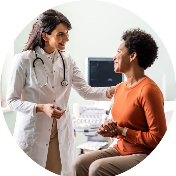 female doctor speaking with a patient